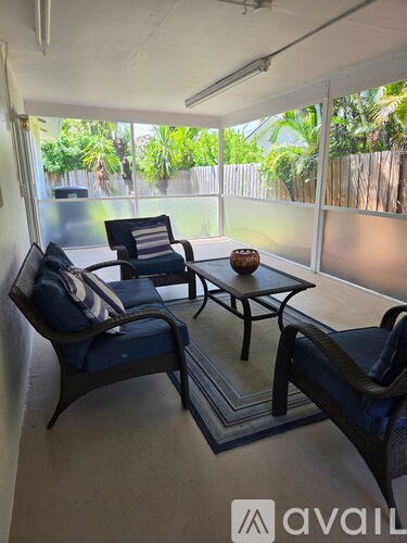 A patio with a table and chairs is available for rent.
