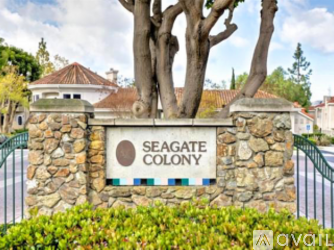 A sign that says Seagate Colony in front of a building.