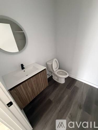 A bathroom with a toilet and sink.
