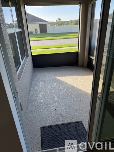 A view from inside a building looking out through a glass door.