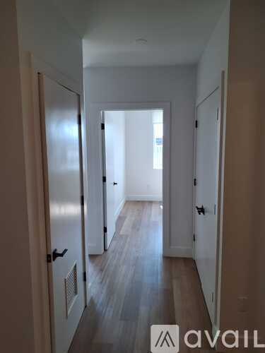 A hallway with a logo that says "avaiL" on the bottom right.
