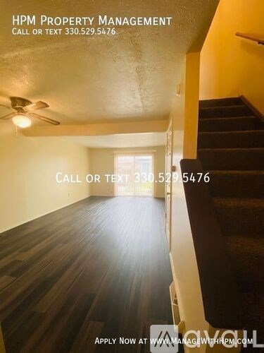 A staircase in a house with a call to action to apply for property management.