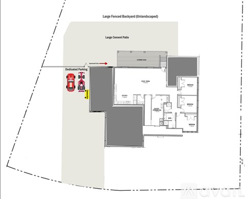 A floor plan of a building with a large fenced backyard, a large cement patio, and a dedicated parking area.