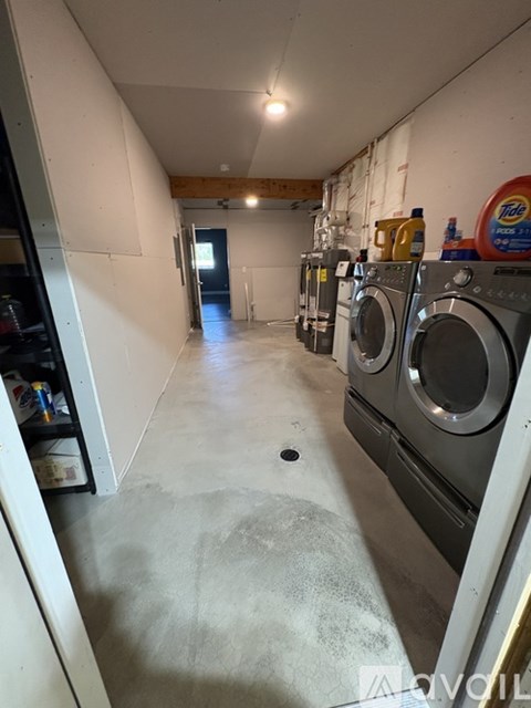 A laundry room with a washer and dryer.