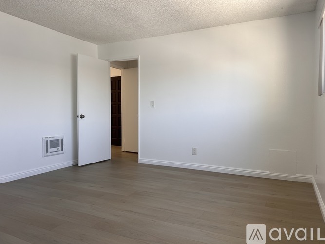A room with a door and a window.