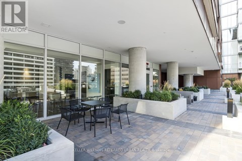 A patio area with tables and chairs is shown.