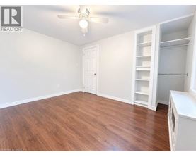 A room with a wooden floor and white walls.