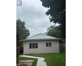 A house with a grey roof and a small porch.