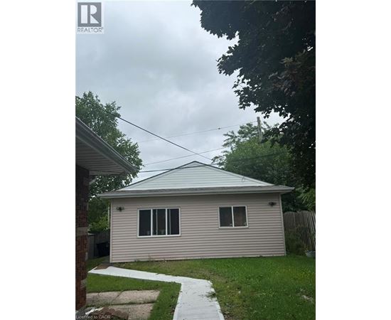 A house with a grey roof and a small porch.