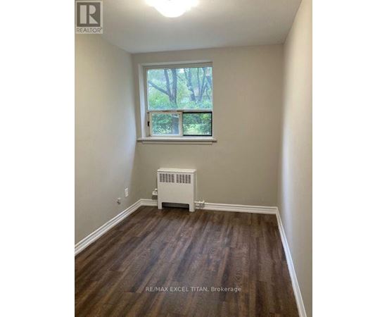 A room with a window and a radiator.