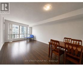 A room with a table and chairs in it.