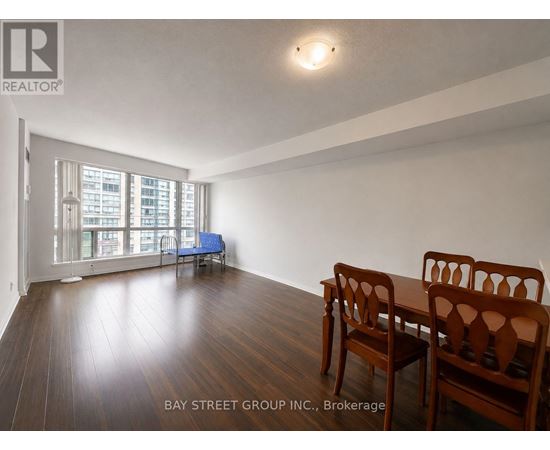 A room with a table and chairs in it.