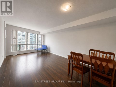 A room with a table and chairs in it.