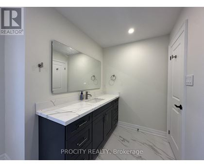 A bathroom with a sink and mirror.