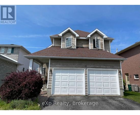 A house with a brown roof and two white garage doors.