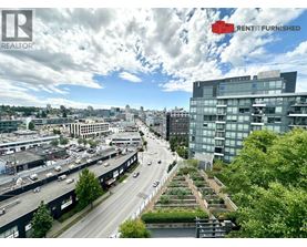 A cityscape with a highway and a building with the words "RENT IT FURNISHED" on it.