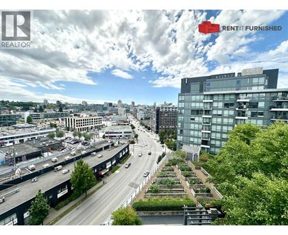 A cityscape with a highway and a building with the words "RENT IT FURNISHED" on it.