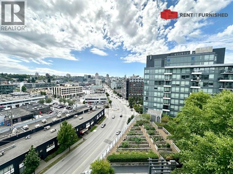 A cityscape with a highway and a building with the words "RENT IT FURNISHED" on it.