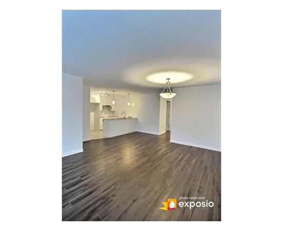 A room with wooden floors and white walls.
