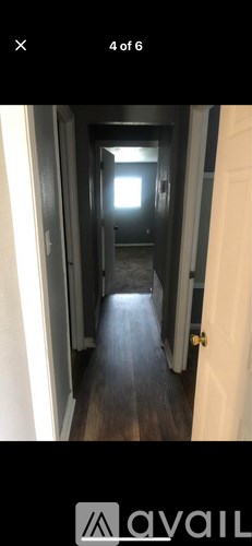 A long hallway with a light at the end.