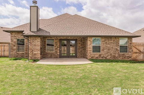 A house with a brown roof and a chimney is for sale.