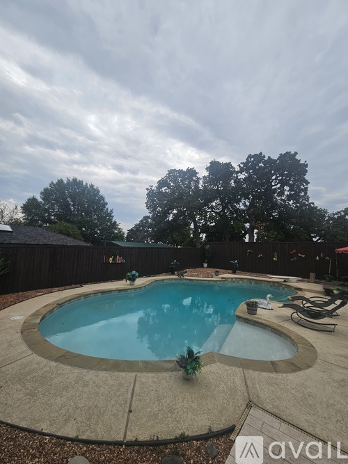 A small kid is playing in the pool.