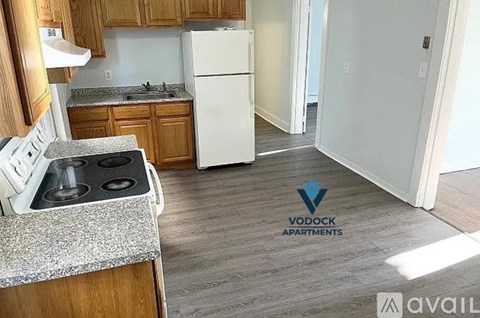 A Vodock Apartments logo is on a kitchen counter.