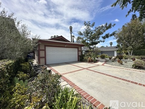 A house with a garage and a driveway.