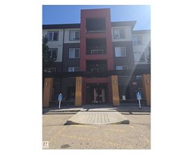 A building with a red section in the middle of it.