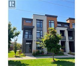 A modern two-story building with a balcony on the second floor.