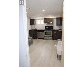 A kitchen with a stove top oven and a dishwasher.