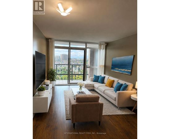 A living room with a couch, a chair, a television, and a large window with a view of the city.