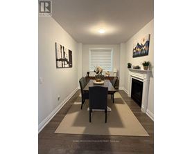 A dining room with a table set for four.