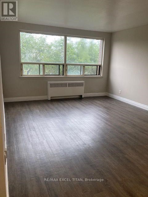 A room with a window and a radiator.