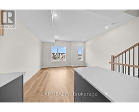A real estate listing photo of a room with EXP Realty Brokerage.