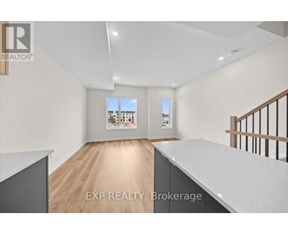 A real estate listing photo of a room with EXP Realty Brokerage.