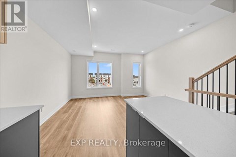 A real estate listing photo of a room with EXP Realty Brokerage.