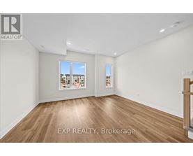 A room with EXP REALTY, Brokerage written on the floor.