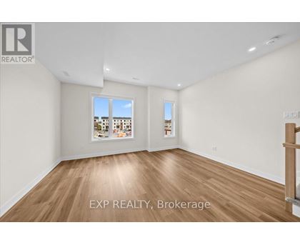 A room with EXP REALTY, Brokerage written on the floor.