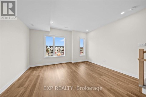 A room with EXP REALTY, Brokerage written on the floor.