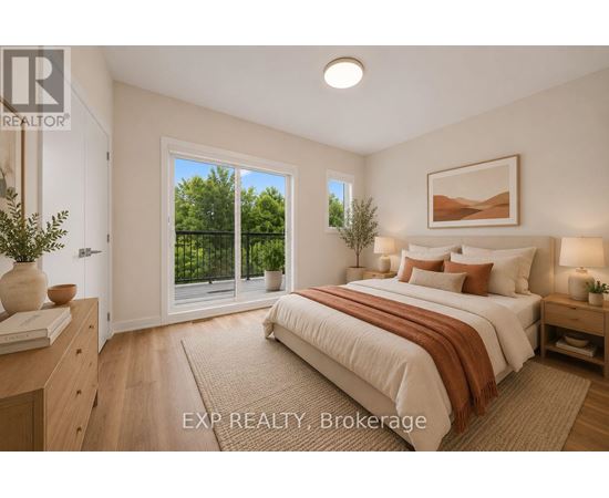 A bedroom with a large bed and a view of trees through the window.