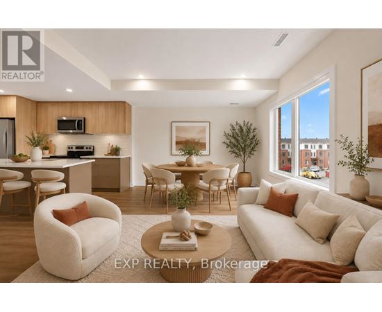 A well-lit, modern living room with a dining area and kitchen in the background.