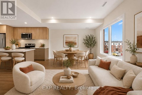 A well-lit, modern living room with a dining area and kitchen in the background.