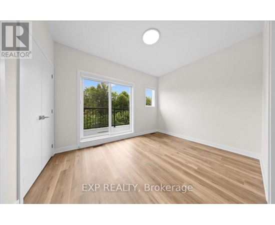 A room with EXP REALTY, Brokerage written on the floor.