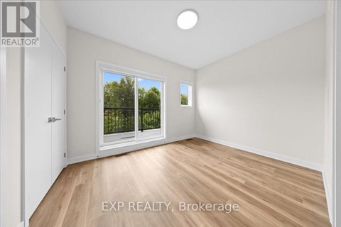 A room with EXP REALTY, Brokerage written on the floor.