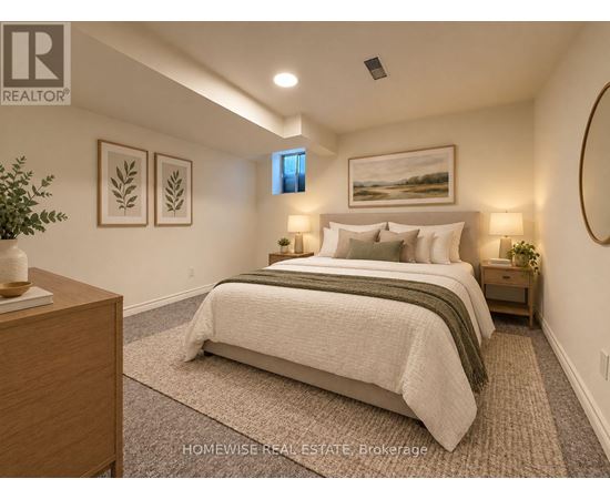 A bedroom with a large bed and a painting on the wall.