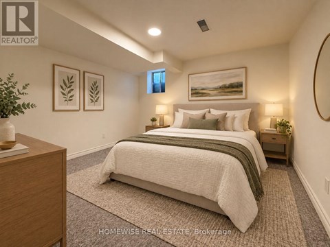 A bedroom with a large bed and a painting on the wall.