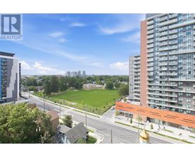 A cityscape with a mix of residential buildings and green spaces.