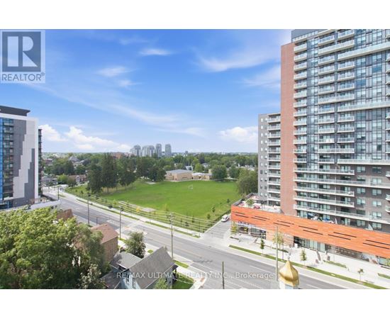 A cityscape with a mix of residential buildings and green spaces.