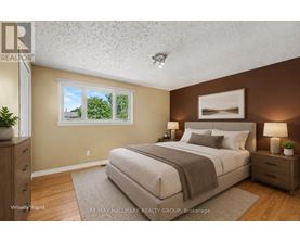 A bedroom with a bed, nightstands, and a window.